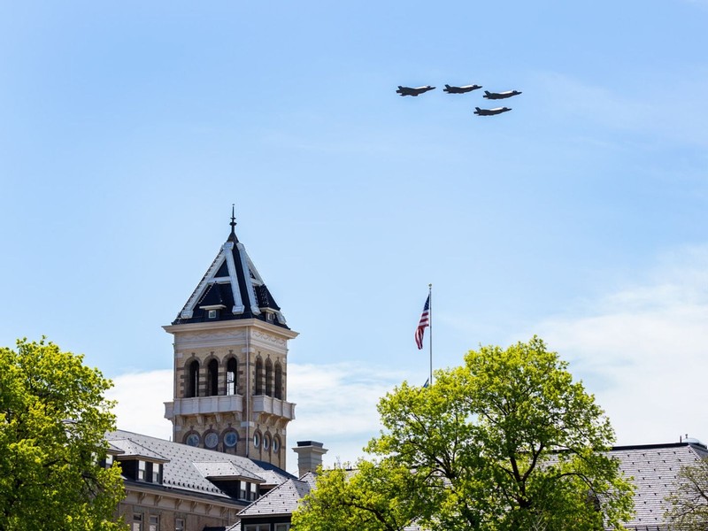 Four F-35 fighter jets fly past Old Main